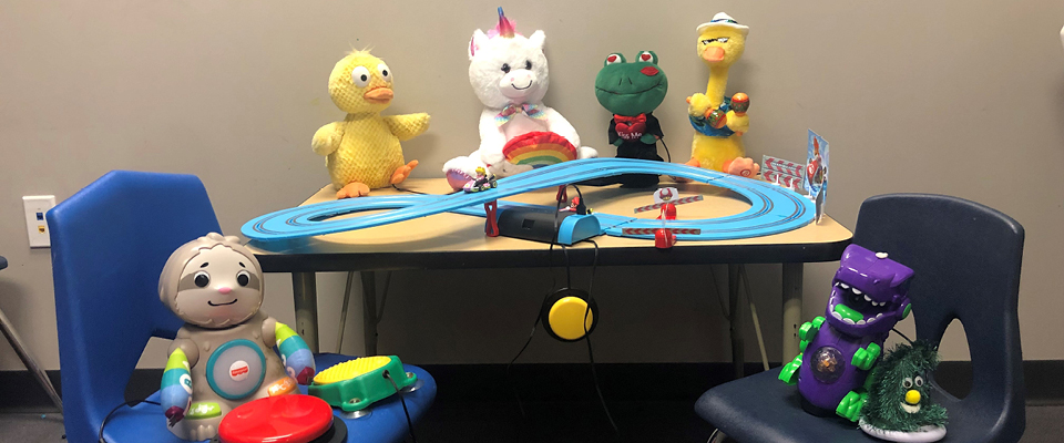 An assortment of adaptive electronic toys on display